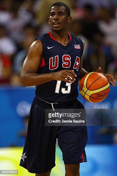 Chris Paul of the United States moves the ball while taking on Angola during the men's preliminary round basketball game at the Beijing Olympic...