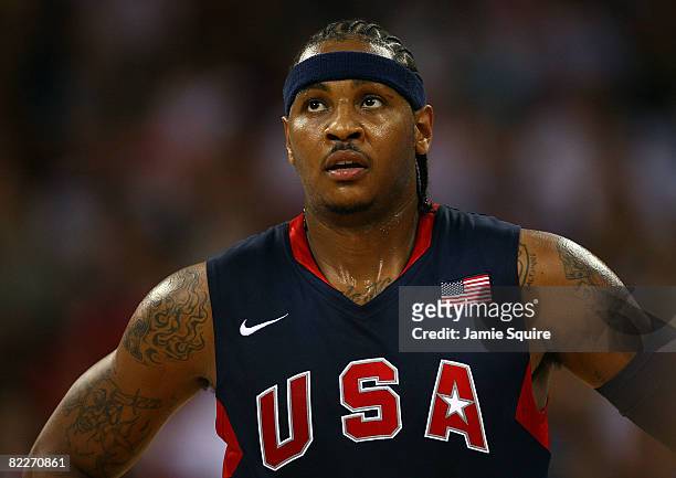 Carmelo Anthony of the United States looks on while taking on Angola during the men's preliminary round basketball game at the Beijing Olympic...