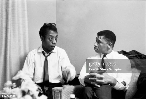 American author and activist James Baldwin speaks with Civil Rights activist Medgar Evers , 1960s.