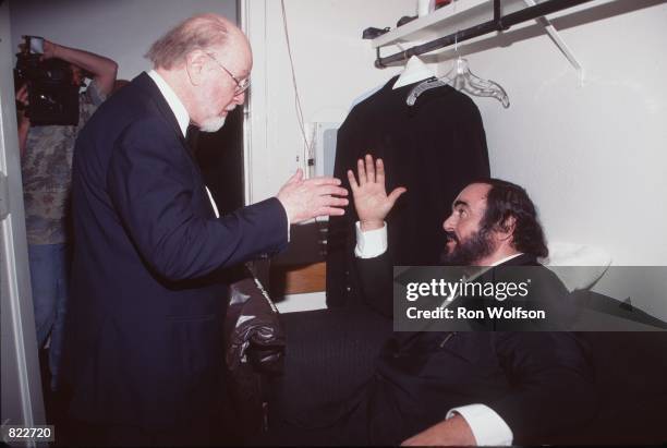 Lucianno Pavarotti chats with composer John Williams February 24, 1999 at the 41st Annual Grammy Awards in Los Angeles, CA.