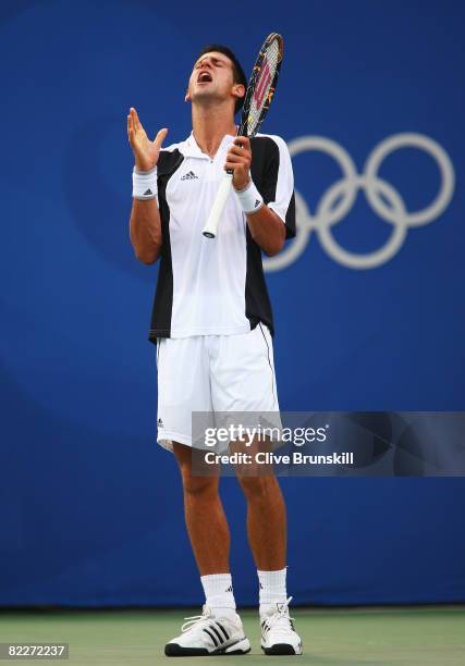 Novak Djokovic of Serbia reacts against Rainer Schuettler of Germany in the Men's Singles Second Round match at the Olympic Green Tennis Center...