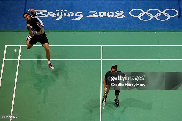 Renee Flavell and Craig Cooper of New Zealand compete against Lee Kyungwon and Lee Yongdae of South Korea in Mixed Doubles Badminton at the Beijing...