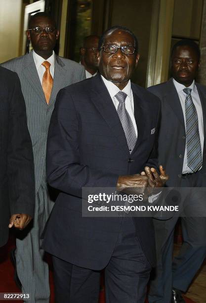 Zimbabwean President Robert Mugabe arrives on August 12, 2008 at the Rainbow towers hotel in Harare to hold talks with the main Zimbabwe opposition...