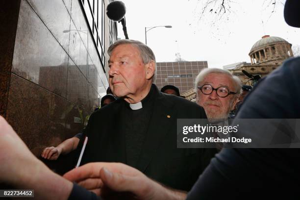 Cardinal George Pell walks with a heavy Police guard from the Melbourne Magistrates' Court on July 26, 2017 in Melbourne, Australia. Cardinal Pell...