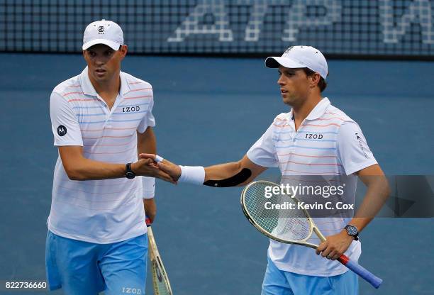 Bob and Mike Bryan reacts in the match against John-Patrick Smith of Australia and Matt Reid during the BB&T Atlanta Open at Atlantic Station on July...