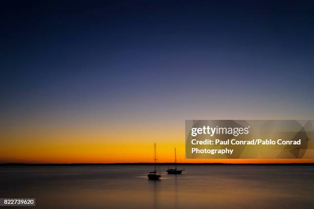 two lone boats - bellingham stockfoto's en -beelden