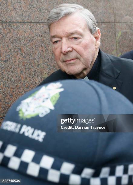 Cardinal George Pell leaves the Melbourne Magistrates Court with a heavy police guard in Melbourne on July 26, 2017 in Melbourne, Australia. Cardinal...