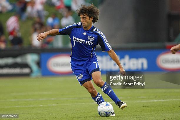 Claudio Lopez of the Kansas City Wizards dribbles the ball against Chivas USA during the game at Community America Ballpark on August 9, 2008 in...