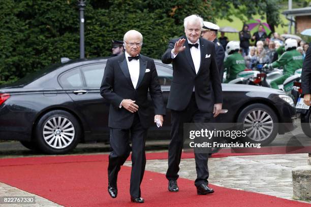 Bavarian State Governor Horst Seehofer and King of Sweden Carl XVI Gustaf attend the Bayreuth Festival 2017 Opening on July 25, 2017 in Bayreuth,...