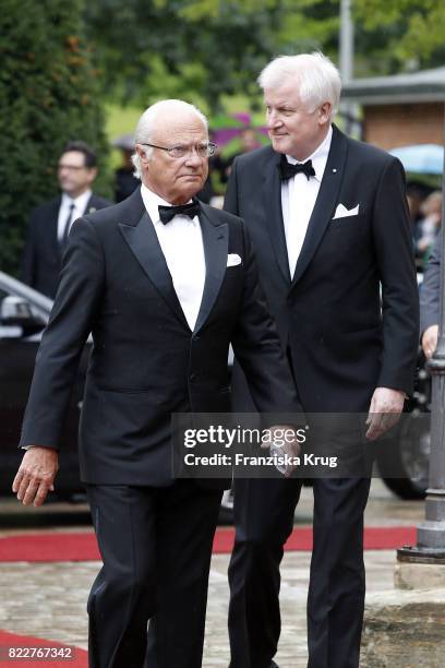 Bavarian State Governor Horst Seehofer and King of Sweden Carl XVI Gustaf attend the Bayreuth Festival 2017 Opening on July 25, 2017 in Bayreuth,...