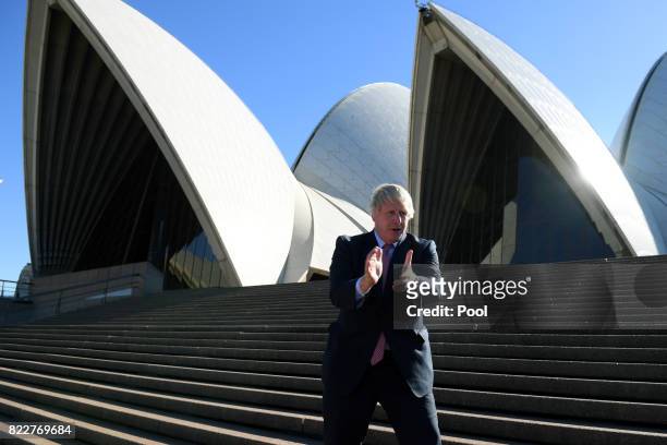 Foreign Secretary Boris Johnson gestures after posing for a photograph at the Sydney Opera House, in Sydney, Wednesday, July 26, 2017. UK Foreign...