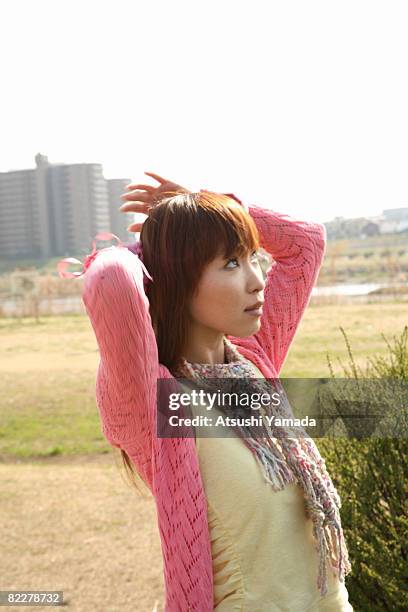 japanese woman walking in the park - atsushi yamada stock pictures, royalty-free photos & images