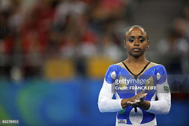 Brazil's Daiane Santos looks on as she competes on the floor during the women's team final of the artistic gymnastics event of the Beijing 2008...