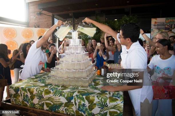 Guests look on during the margarita tower at the Cointreau Celebrates the Original Margarita and the Art of La Soiree with Caroline Harper Knapp at...