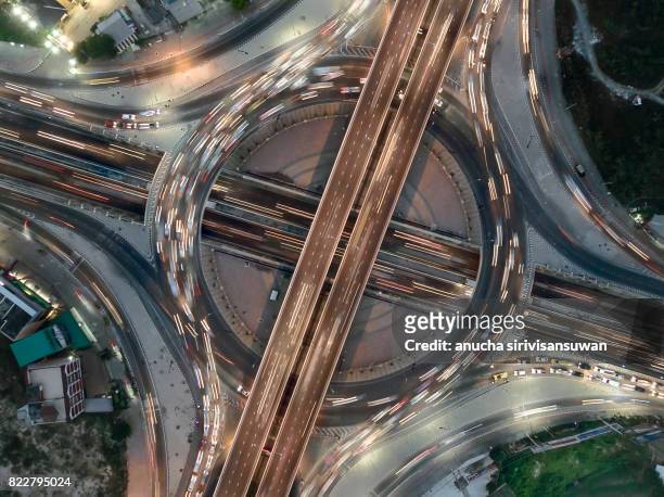 road roundabout large the road has six lines beautiful at night  , bird eye view . - top of the world photos et images de collection