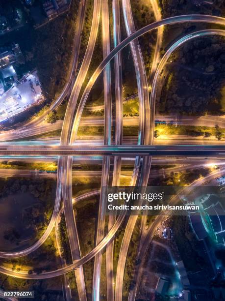 interchange highway traffic beautiful at night, bird eye view in bangkok , top view , bangkok , thailand . - airport aerial stock pictures, royalty-free photos & images