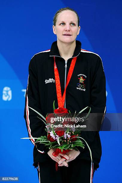 Kirsty Coventry of Zimbabwe poses with the silver medal during the medal ceremony for the Women's 200m Individual Medley at the National Aquatics...