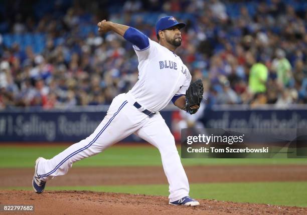 Cesar Valdez of the Toronto Blue Jays delivers a pitch in the sixth inning during MLB game action against the Oakland Athletics at Rogers Centre on...