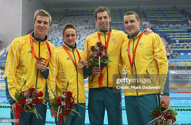 Grant Brits, Nick Ffrost, Grant Hackett, Patrick Murphy of Australia pose with the bronze medal during the medal ceremony for the Men's 4 x 200m...