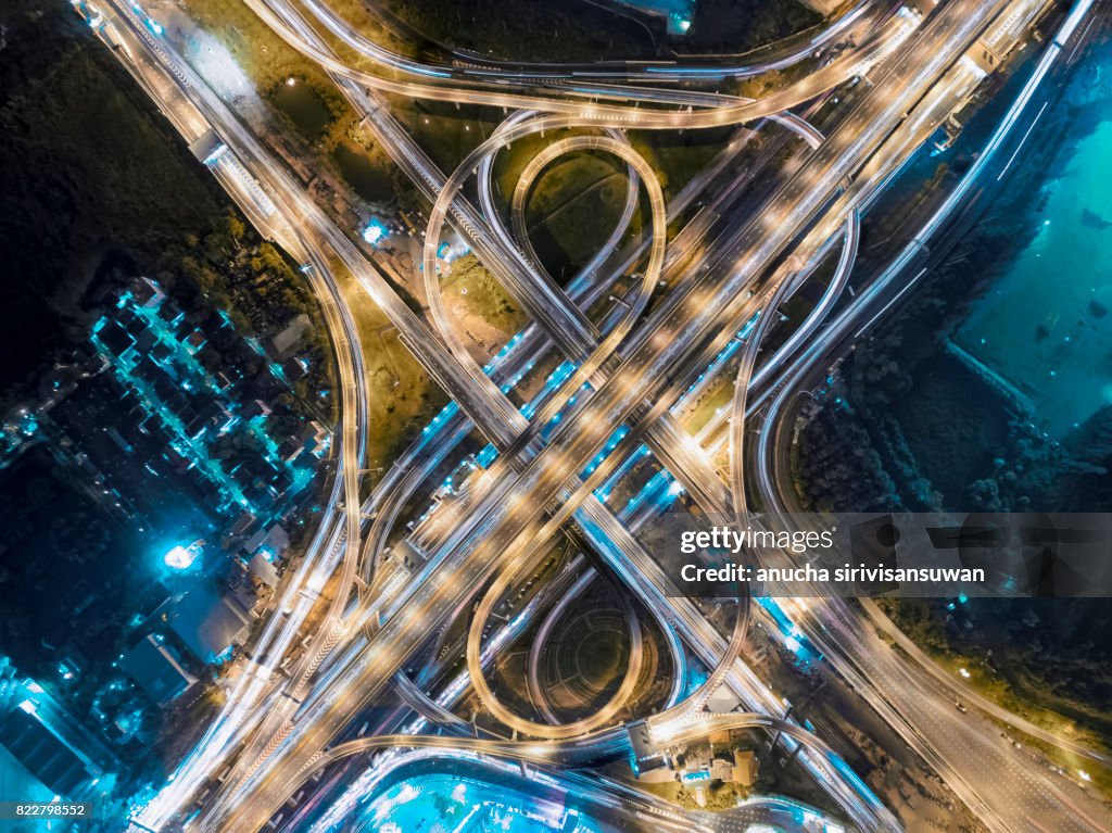 Road beautiful Aerial View of Busy Intersection at Night , top view , thailand .