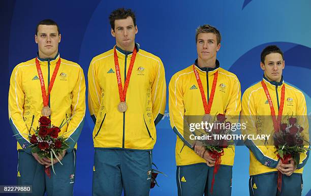 Bronze medalist Australian swimmers Patrick Murphy, Grant Hackett, Grant Brits and Nick Ffrost stand on the podium for the men's 4 x 200m freestyle...