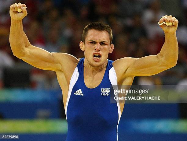 France's Steeve Guenot jubilates after defeating Kazakhstan's Darkhan Bayakhmetov in their men's Greco-Roman 66 kg semi-final wrestling match for the...