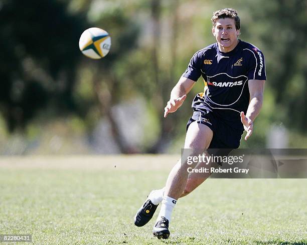 Luke Burgess of the Wallabies looks to catch the ball during the Australian Wallabies training session at St Pius College on August 13, 2008 in...