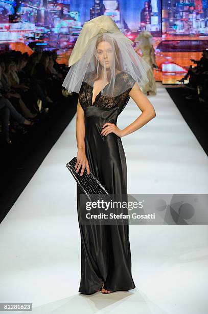 Model showcases designs by Charlie Brown on the catwalk, as part of the inaugural Rosemount Sydney Fashion Festival 2008 at Martin Place on August...