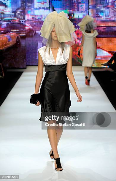 Model showcases designs by Charlie Brown on the catwalk, as part of the inaugural Rosemount Sydney Fashion Festival 2008 at Martin Place on August...