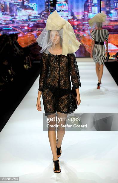 Model showcases designs by Charlie Brown on the catwalk, as part of the inaugural Rosemount Sydney Fashion Festival 2008 at Martin Place on August...