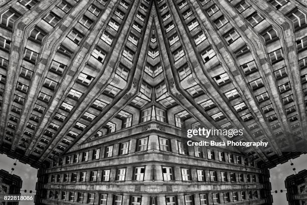 impossible architectures: black and white kaleidoscopic image of prudential tower, a warsaw skyscraper built between 1931 and 1934 in the art deco style - escher stock pictures, royalty-free photos & images