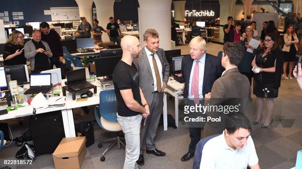 Britain's Foreign Minister Boris Johnson speaks with PayDock CEO Robert Lincolne , British Consul-General Michael Ward and Head of Tyro Fintech Hub...
