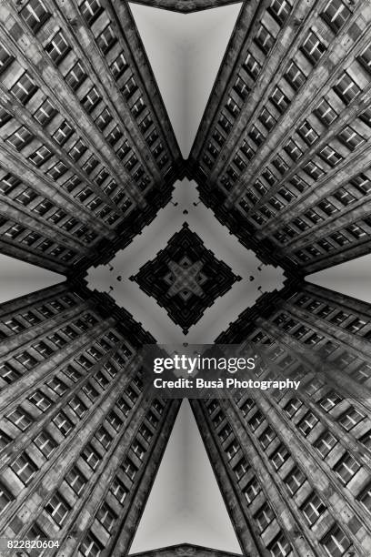 impossible architectures: black and white kaleidoscopic image of prudential tower, a warsaw skyscraper built between 1931 and 1934 in the art deco style - escher stock pictures, royalty-free photos & images