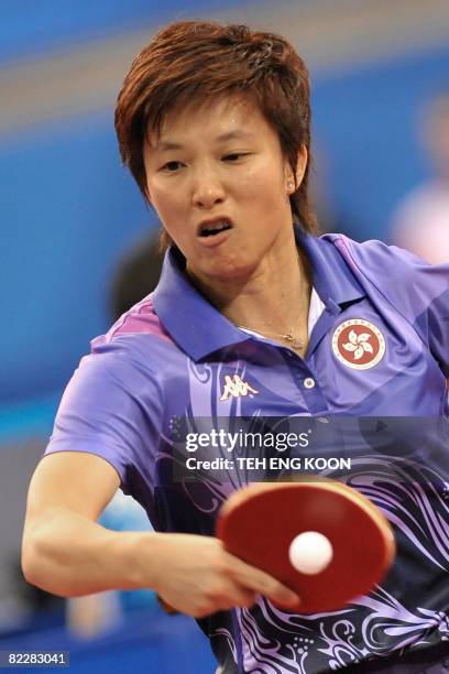 Hong Kong's Ling Ling returns a shot against Poland's Li Qian during the women's team group D table tennis competition at the 2008 Beijing Olympic...