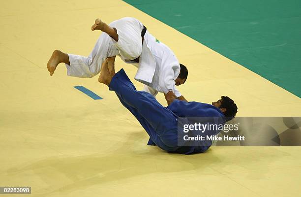 Roberto Meloni of Italy competes against Asley Gonzalez of Cuba in their Men's 90 kg Repechage judo bout at the University of Science and Technology...