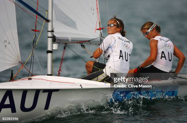 Sylvia Vogl and Carolina Flatscher of Austria of Netherlands compete in the Women's 470 class race held at the Qingdao Olympic Sailing Center during...