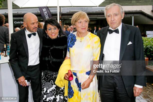 Former German skier Christian Neureuther with his wife former German skiere Rosi Mittermaier and Regine Sixt with her husband Erich Sixt attend the...