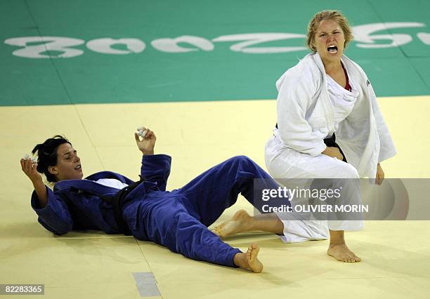 United States' Ronda Rousey reacts as she won against Hungary's Anett Meszaros during their women's -70kg judo match of the 2008 Beijing Olympic...