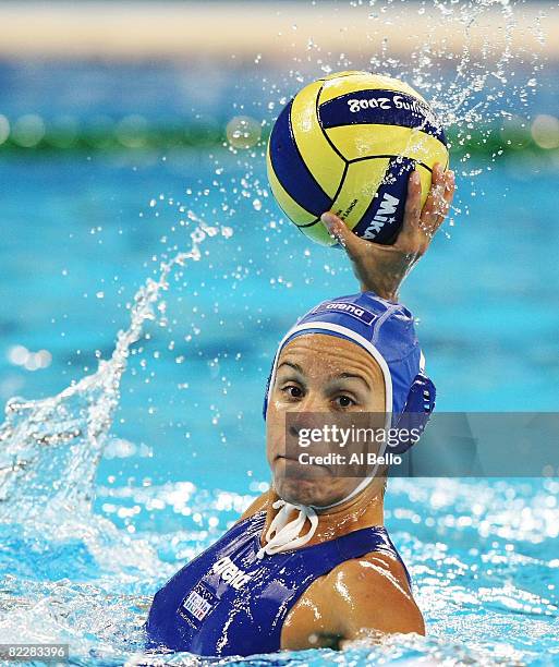 Tania di Mario of Italy looks for an open pass against the United States in the women's preliminary water polo match at the Olympic Sports Center...