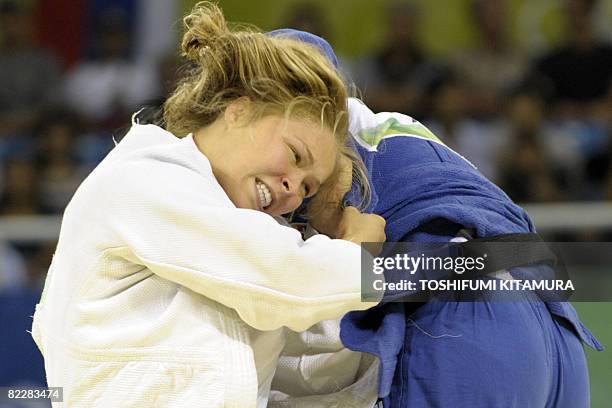 United States' Ronda Rousey and Hungary's Anett Meszaros compete during their women's -70kg judo match of the 2008 Beijing Olympic Games on August...