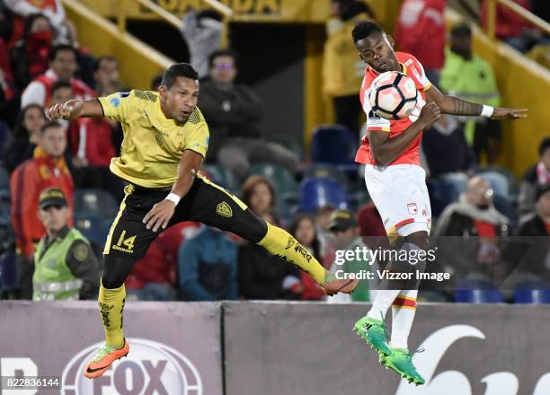 Carlos Arboleda of Independiente Santa Fe fights for the ball with Angel Garcia Toral of Fuerza Amarilla during the match between Independiente Santa...