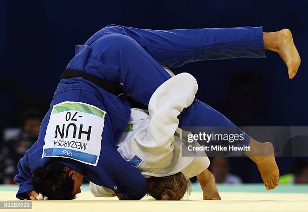 Ronda Rousey of the USA competes against Anett Meszaros of Hungary in their Women's 70 kg Repechage A Final judo bout at the University of Science...