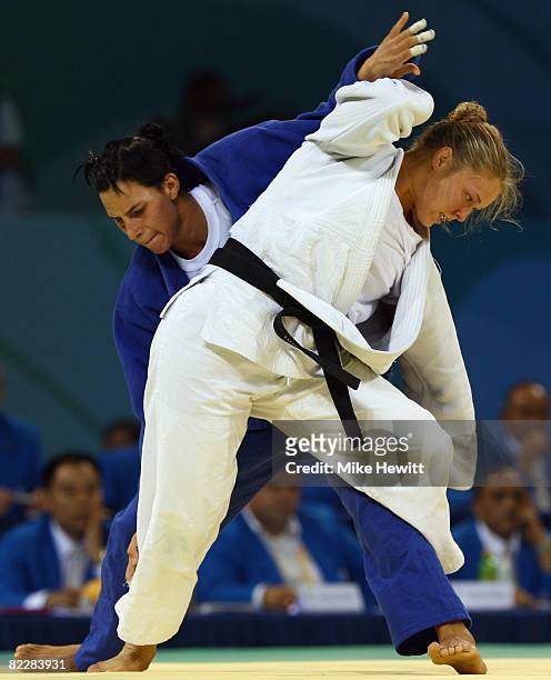 Ronda Rousey of the USA competes against Anett Meszaros of Hungary in their Women's 70 kg Repechage A Final judo bout at the University of Science...