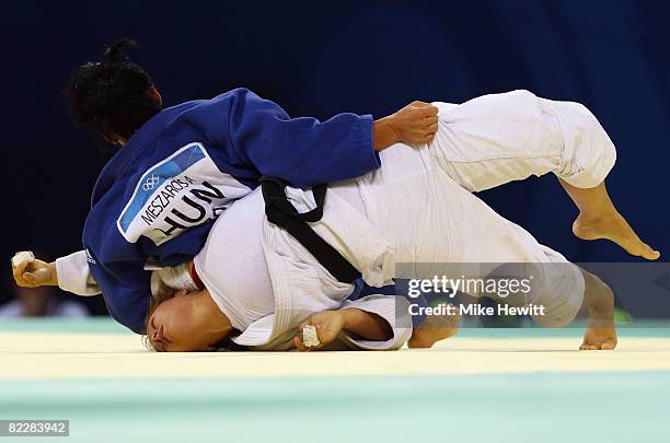 Ronda Rousey of the USA competes against Anett Meszaros of Hungary in their Women's 70 kg Repechage A Final judo bout at the University of Science...