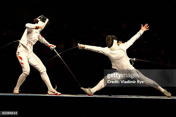 Li Na of China competes against Britta Heidemann of Germany in the women's individual epee semifinal 1 fencing event during Day 5 of the Beijing 2008...