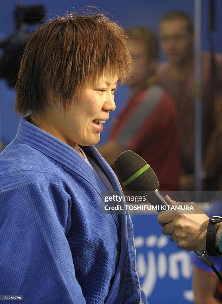 Japan's Masae Ueno speaks to the press a