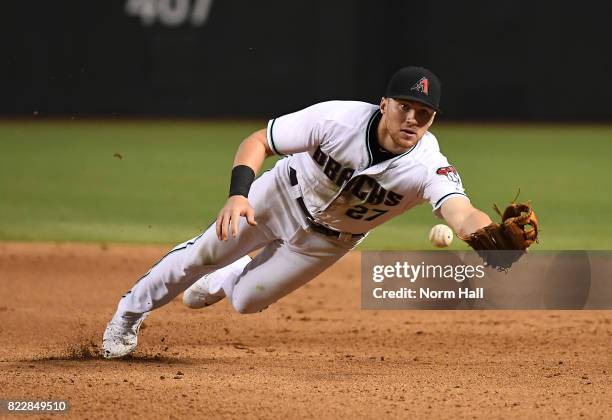 Brandon Drury of the Arizona Diamondbacks attempts to make a diving flip to first base during the ninth inning against the Atlanta Braves at Chase...