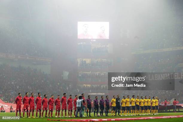 Players of Toluca and Atletico de Madrid make a line prior a friendly match between Toluca and Atletico de Madrid as part of the 100th anniversary of...