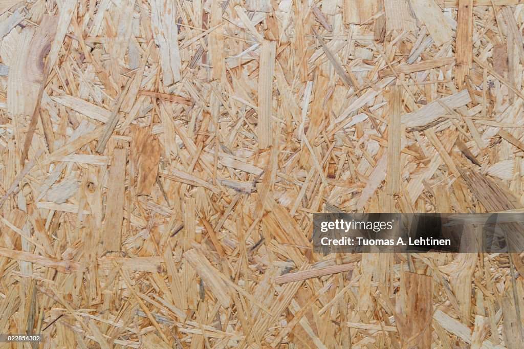 Close-up of a particle board background texture.