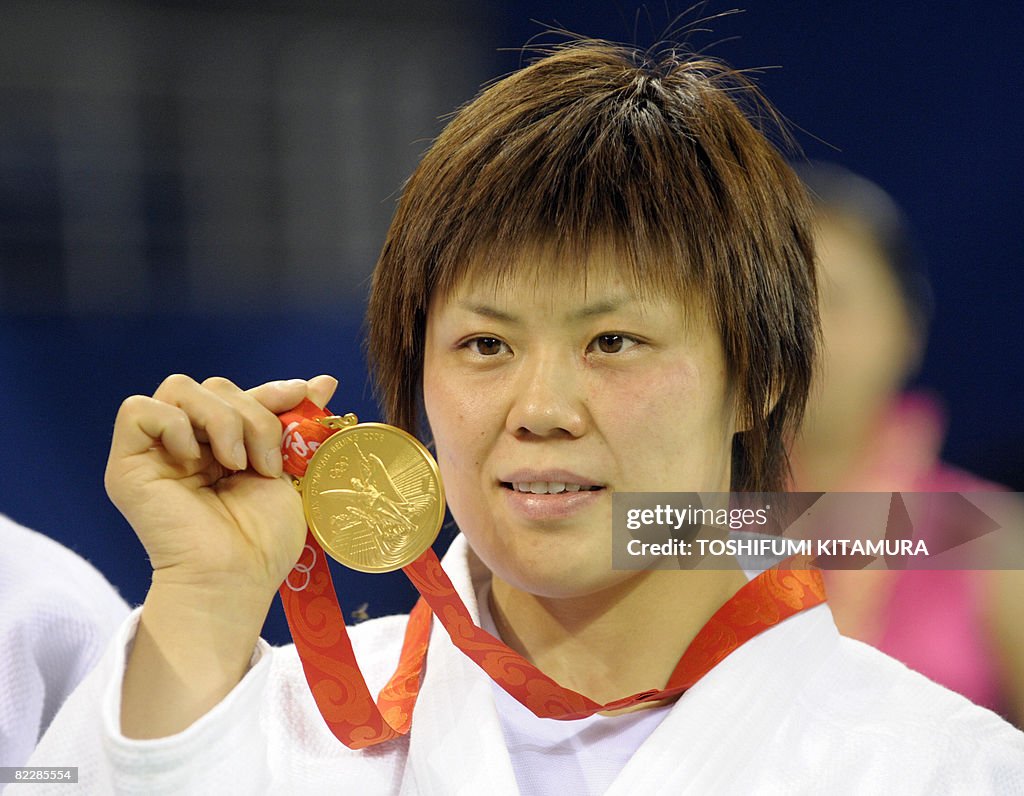 Japan's Masae Ueno poses on the podium w